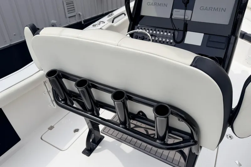 Slide: The Image of 2024 Tidewater 256 LXF boat interior with rod holders and Garmin electronics. - 33