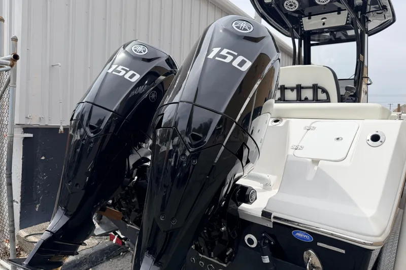 Slide: The Image of 2024 Tidewater 256 LXF boat with dual Yamaha 150 outboard engines. - 7