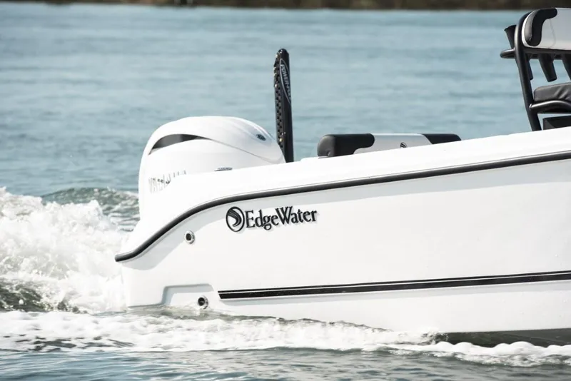 Slide: The Image of Edgewater 208CC Watchman 2025 boat cruising on water. - 5