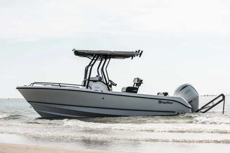 Slide: The Image of 2025 Edgewater 208CC Watchman boat on the water, featuring sleek design and modern features. - 8