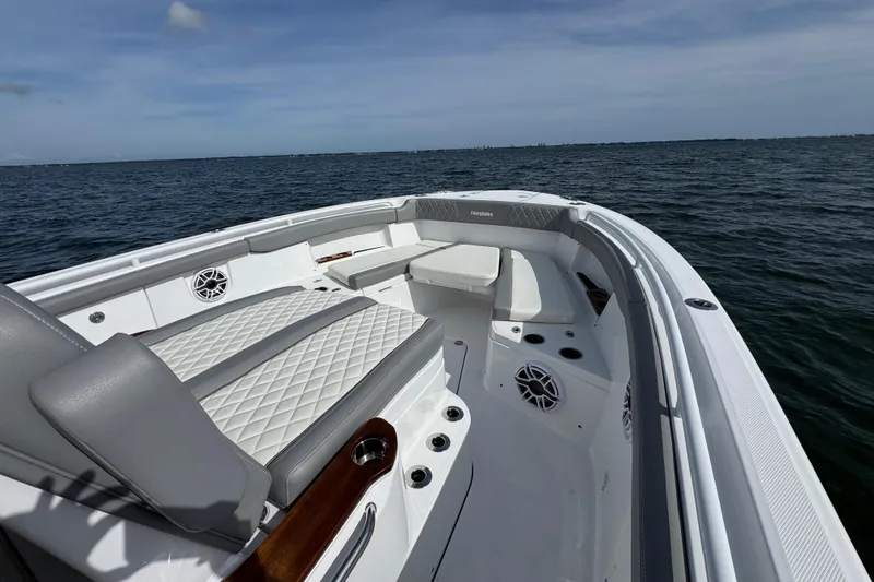 Slide: The Image of 2025 Everglades 315 Center Console boat interior with seating, on open water. - 14