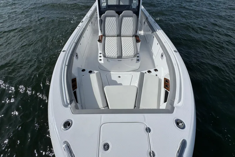 Slide: The Image of 2025 Everglades 315 Center Console boat with spacious seating on open water. - 17