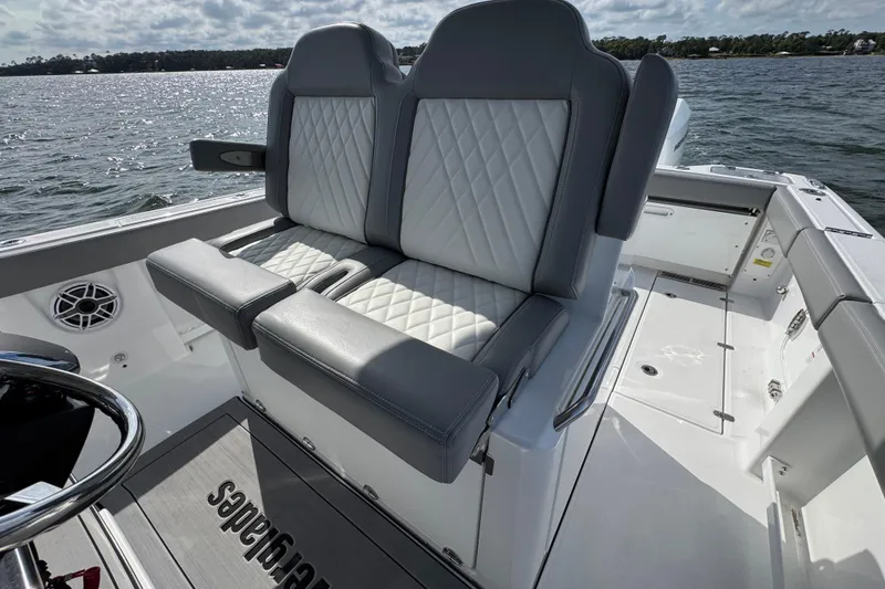 Slide: The Image of 2025 Everglades 315 Center Console boat with luxurious seating on a sunny day. - 29