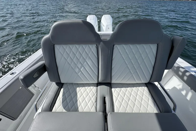 Slide: The Image of 2025 Everglades 315 Center Console boat with luxurious quilted seating on open water. - 30