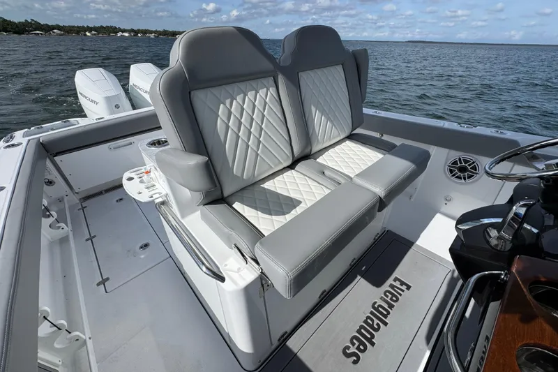 Slide: The Image of 2025 Everglades 315 Center Console boat with luxurious seating and dual Mercury engines. - 32