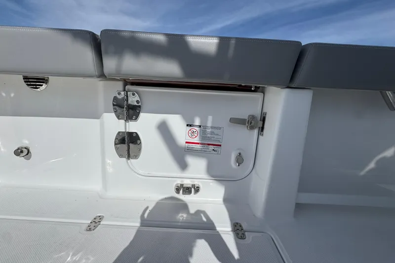Slide: The Image of 2025 Everglades 315 Center Console boat interior with storage compartment and seating. - 36