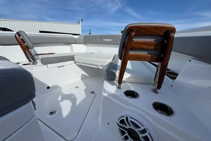 Slide: The Image of 2025 Everglades 315 Center Console interior with seating, cup holders, and speaker. - 44