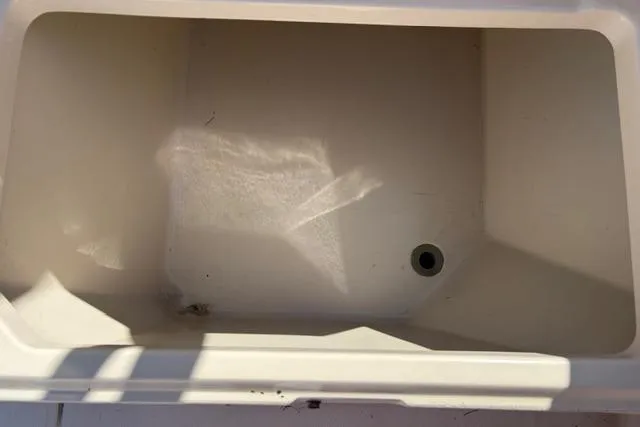 Slide: The Image of Empty storage compartment on a 1994 Grady-White Explorer 244 boat. - 10