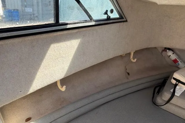 Slide: The Image of Interior cabin of 1994 Grady-White Explorer 244 boat with window and fire extinguisher. - 14