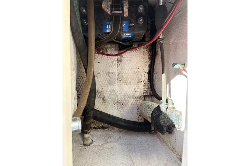 Slide: The Image of 1994 Grady-White Explorer 244 boat interior wiring and components. - 15