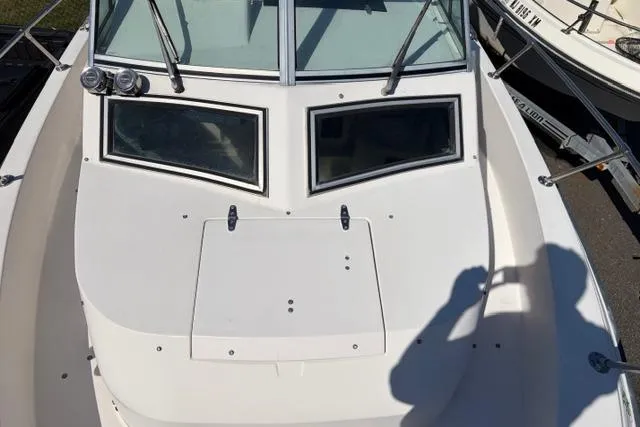 Slide: The Image of 1994 Grady-White Explorer 244 boat deck with windshield and shadow. - 4