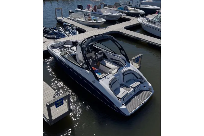 The Image of 2017 Yamaha Boats 242 Limited S docked at marina, surrounded by other boats. - 0
