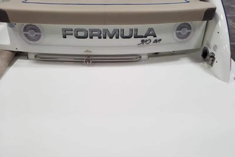 Slide: The Image of 2019 Formula 310 Bowrider boat rear view with speakers and branding. - 11