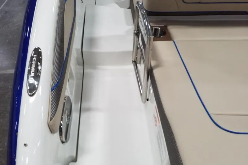 Slide: The Image of 2019 Formula 310 Bowrider interior with sleek seating and stainless steel details. - 15