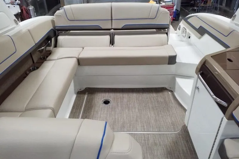 Slide: The Image of 2019 Formula 310 Bowrider interior with beige seating and modern design. - 16