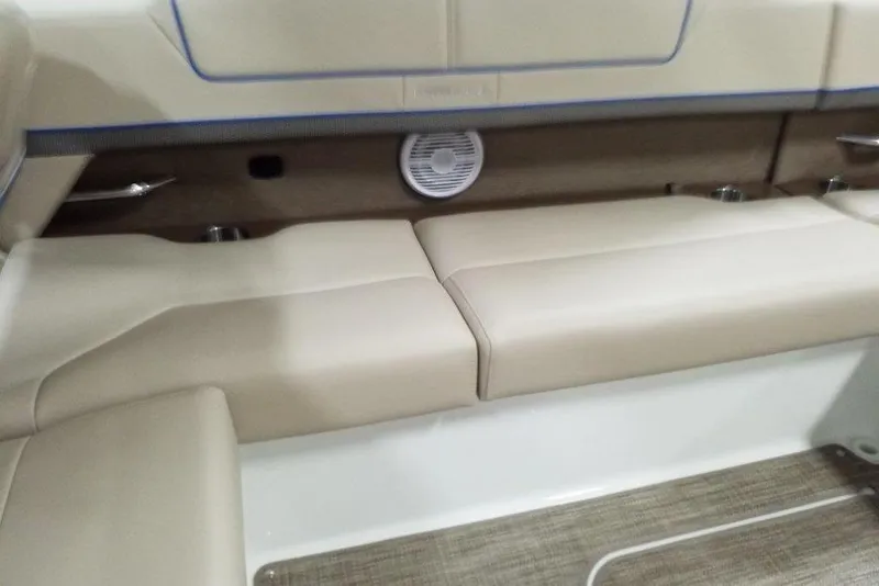 Slide: The Image of 2019 Formula 310 Bowrider interior seating with beige upholstery and integrated speaker. - 17