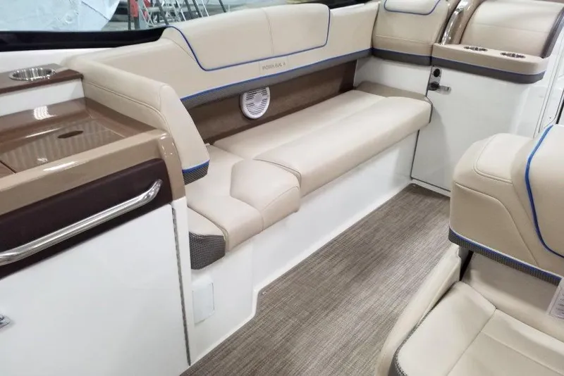 Slide: The Image of 2019 Formula 310 Bowrider interior with beige seating and modern design. - 19