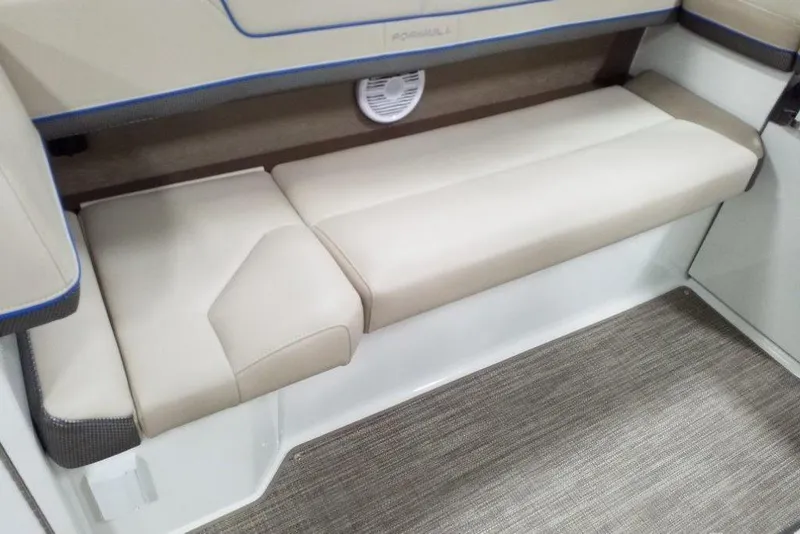Slide: The Image of 2019 Formula 310 Bowrider interior seating with beige upholstery and modern design. - 24