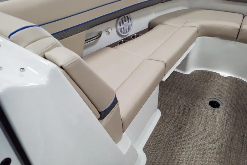 Slide: The Image of 2019 Formula 310 Bowrider interior with beige seating and carpeted flooring. - 31