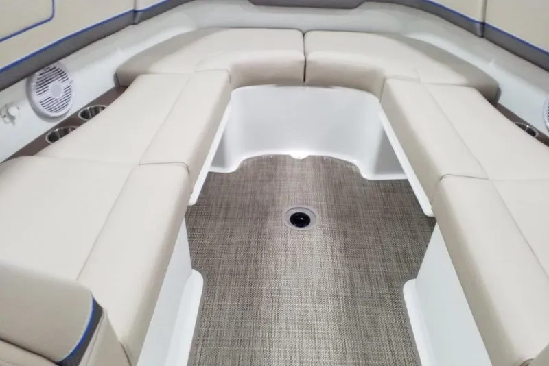 Slide: The Image of 2019 Formula 310 Bowrider interior with beige seating and carpeted flooring. - 32