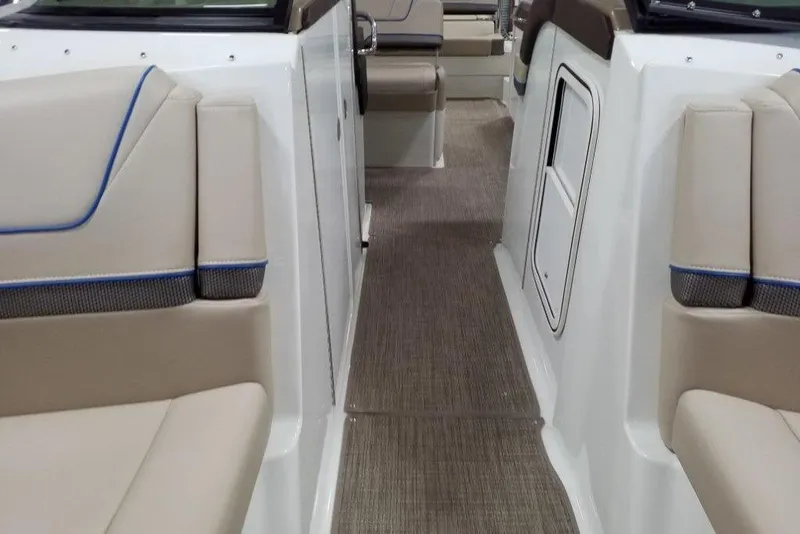 Slide: The Image of Interior view of a 2019 Formula 310 Bowrider boat with beige seating. - 33