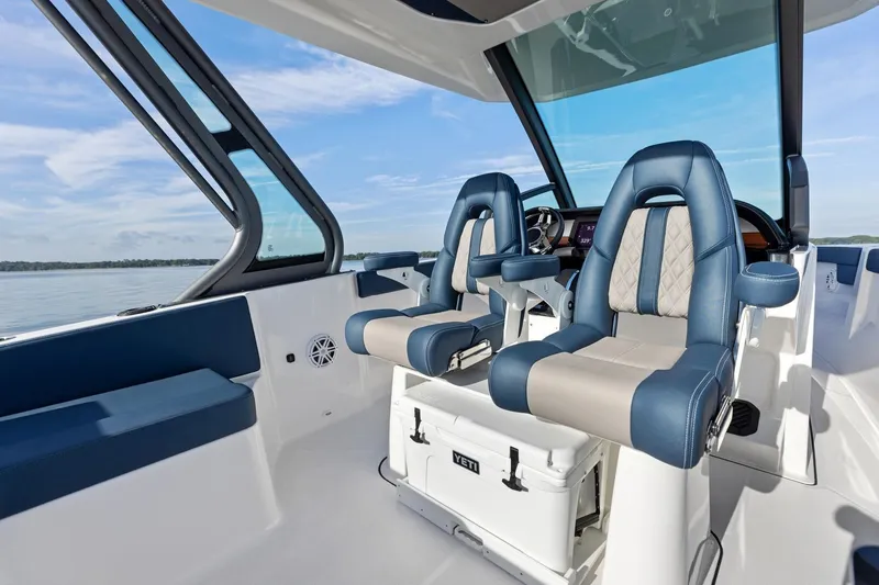 Slide: The Image of Manufacturer Provided Image: Interior of 2026 Monterey Elite 25 OB boat with luxurious seating and modern design. - 2