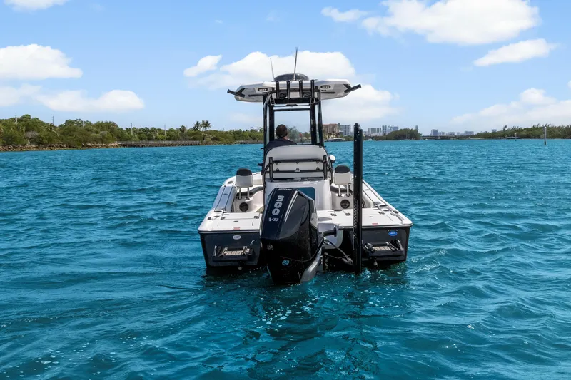 The Image of 2026 Tidewater 2500 Carolina Bay boat cruising on clear blue water. - 1