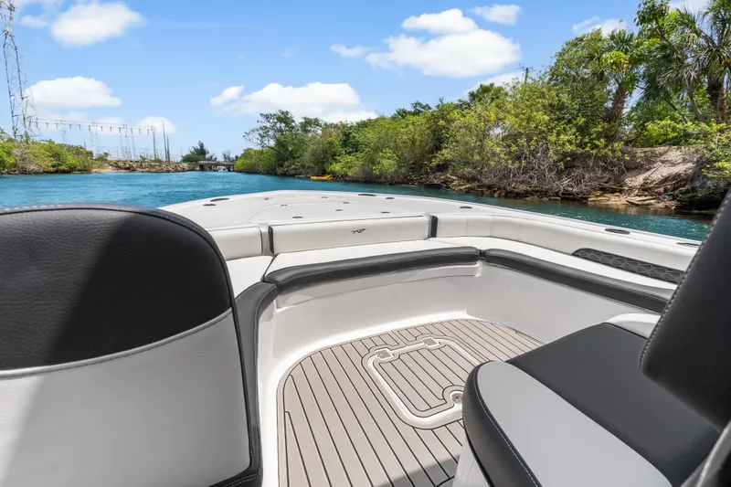 Slide: The Image of 2026 Tidewater 2500 Carolina Bay boat interior on a scenic waterway. - 10