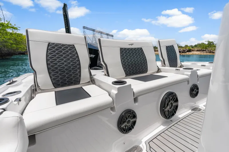 Slide: The Image of 2026 Tidewater 2500 Carolina Bay boat seats with stylish upholstery and cup holders. - 12