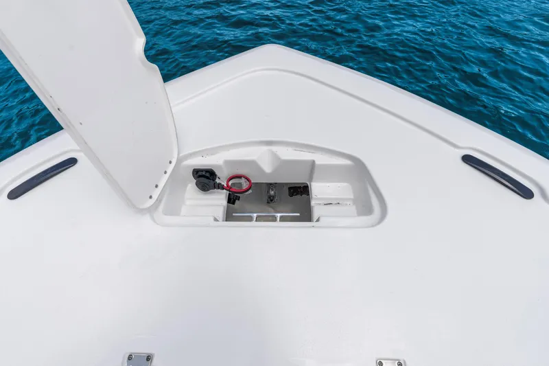 Slide: The Image of Bow storage compartment on 2026 Tidewater 2500 Carolina Bay boat, with ocean backdrop. - 15
