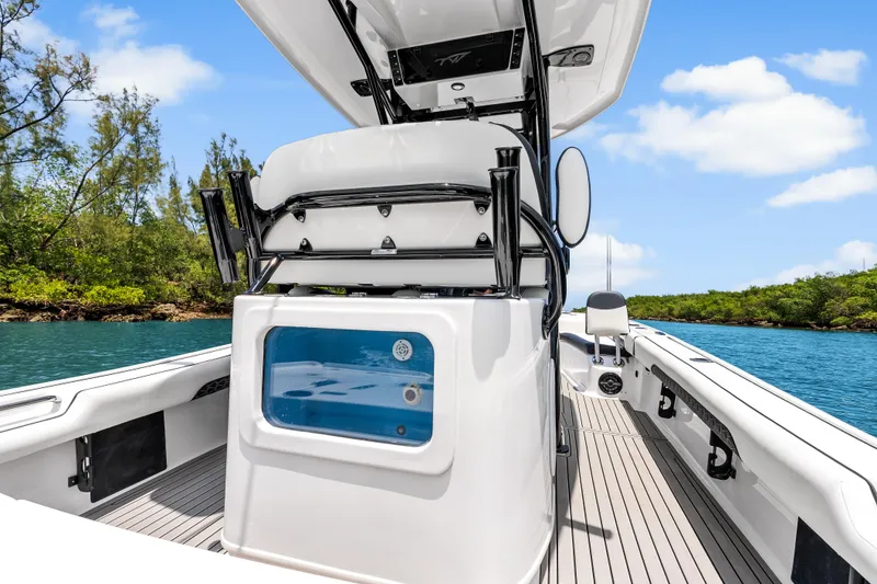 Slide: The Image of 2026 Tidewater 2500 Carolina Bay boat on serene water, featuring sleek design and modern amenities. - 18