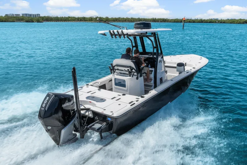 Slide: The Image of 2026 Tidewater 2500 Carolina Bay boat cruising on clear blue water. - 5