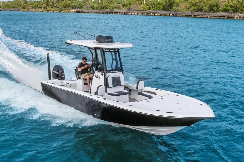 Slide: The Image of 2026 Tidewater 2500 Carolina Bay boat cruising on clear blue water. - 7