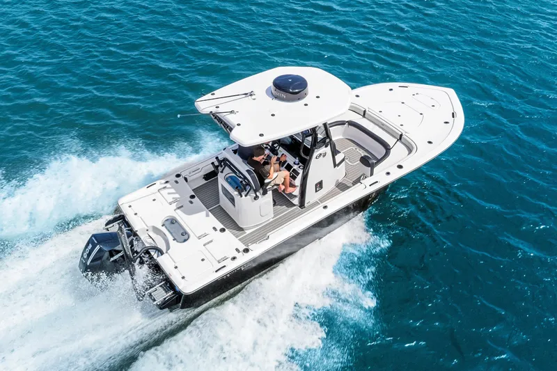Slide: The Image of 2026 Tidewater 2500 Carolina Bay boat cruising on clear blue water. - 8