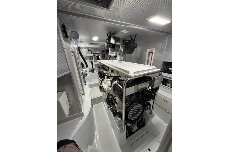 Slide: The Image of Engine room of a 2016 Nordhavn 52 yacht, showcasing machinery and equipment. - 22