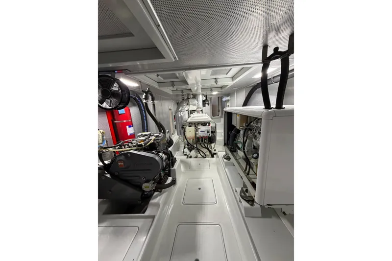 Slide: The Image of Engine room of a 2016 Nordhavn 52 yacht, showcasing machinery and equipment. - 24
