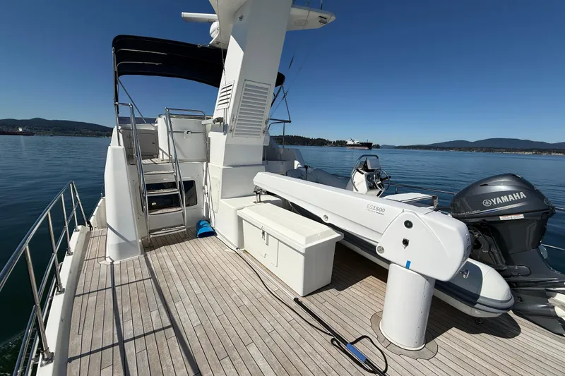 Slide: The Image of 2016 Nordhavn 52 yacht deck with Yamaha motor and scenic ocean view. - 5
