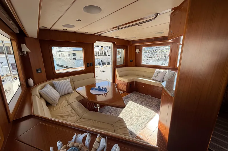 Slide: The Image of Luxurious interior of a 2016 Nordhavn 52 yacht with elegant wood finishes and plush seating. - 8