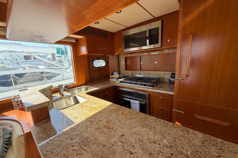 Slide: The Image of Luxurious kitchen interior of 2016 Nordhavn 52 yacht with granite countertops and modern appliances. - 9