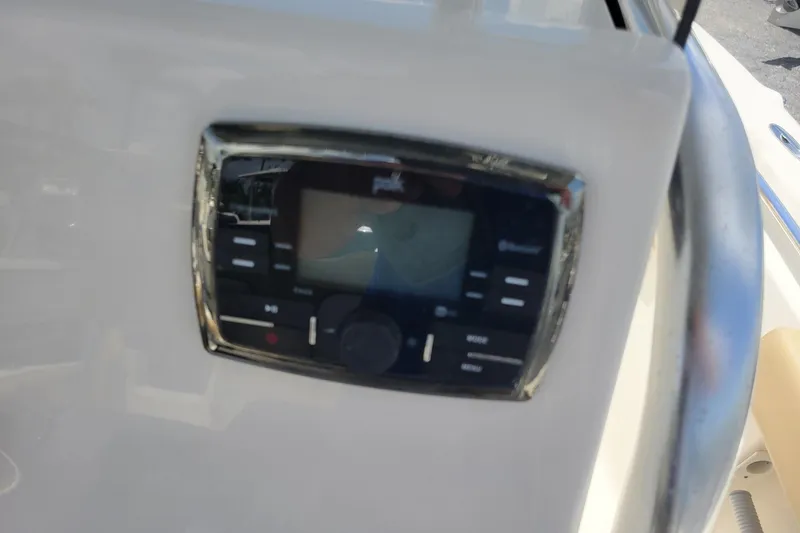 Slide: The Image of Control panel on a 2019 Key West 219 FS boat dashboard. - 10