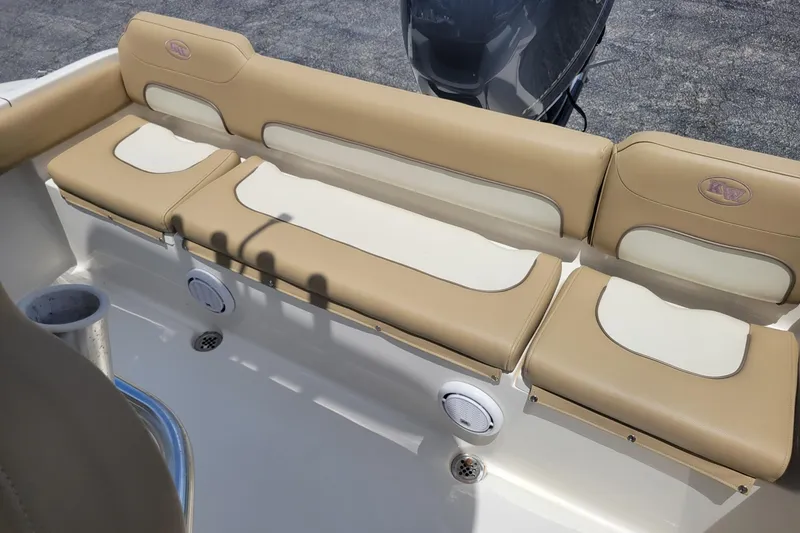 Slide: The Image of 2019 Key West 219 FS boat with beige seating and cup holders. - 6
