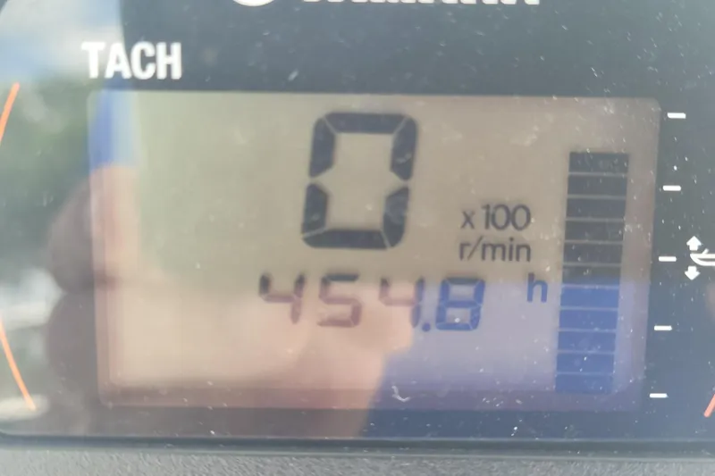 Slide: The Image of Digital tachometer display showing 454.8 hours on a 2019 Key West 219 FS boat. - 8