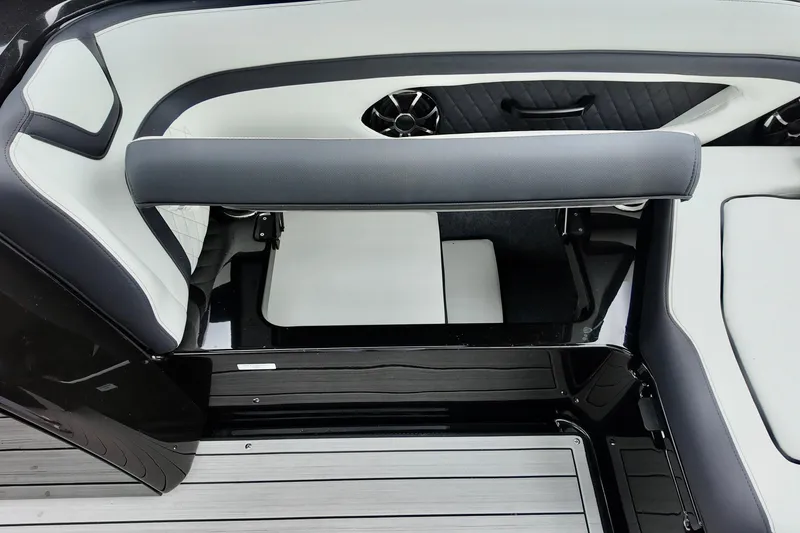Slide: The Image of Interior seating of 2025 Yamaha 275 SD boat, featuring sleek black and white design. - 12