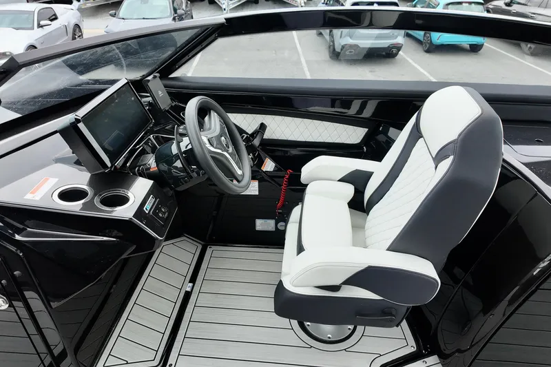 Slide: The Image of 2025 Yamaha 275 SD boat cockpit with modern steering and luxurious seating. - 16