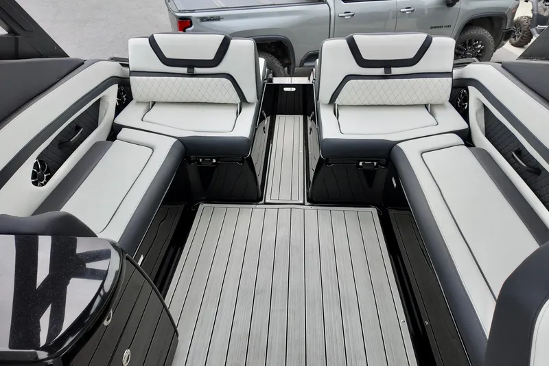Slide: The Image of 2025 Yamaha 275 SD boat interior with sleek seating and modern design. - 18