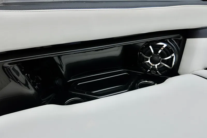 Slide: The Image of 2025 Yamaha 275 SD boat interior with sleek speaker and white seating. - 21