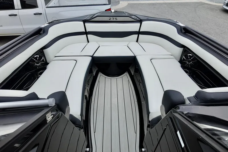 Slide: The Image of 2025 Yamaha 275 SD boat interior with sleek seating and modern design. - 23