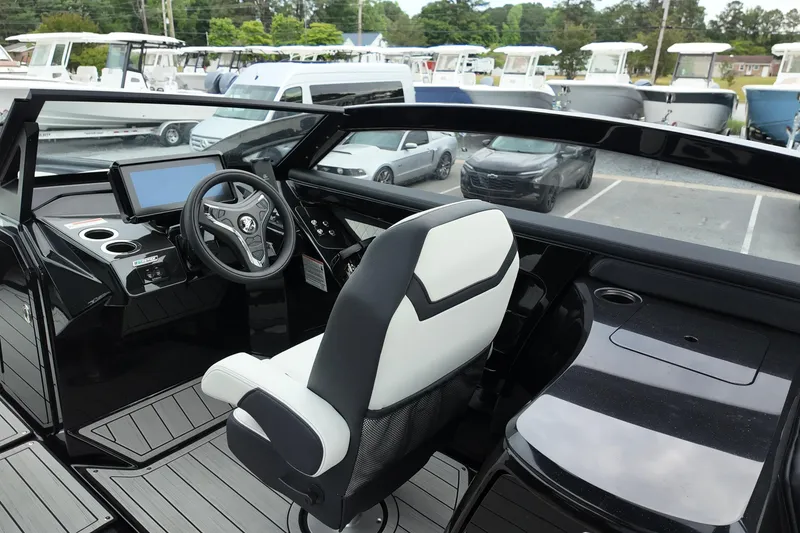 Slide: The Image of Interior view of 2025 Yamaha 275 SD boat cockpit with steering wheel and dashboard. - 6