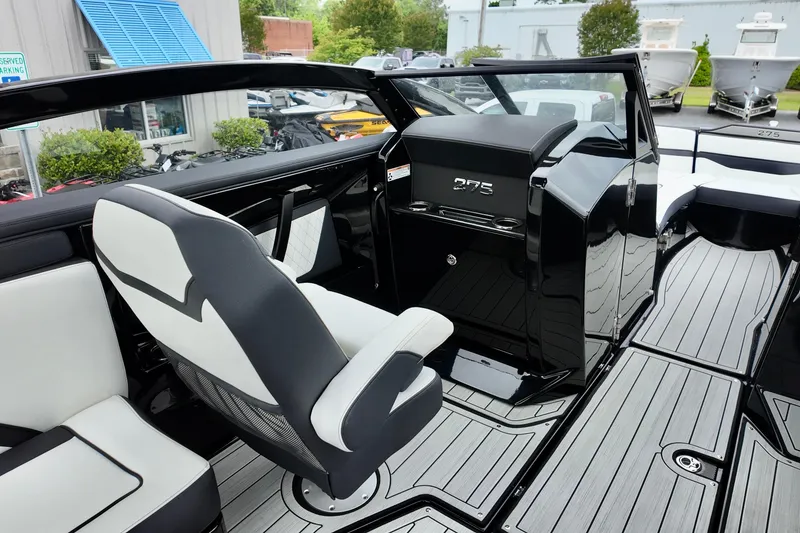 Slide: The Image of 2025 Yamaha 275 SD boat interior with sleek seating and modern design. - 7