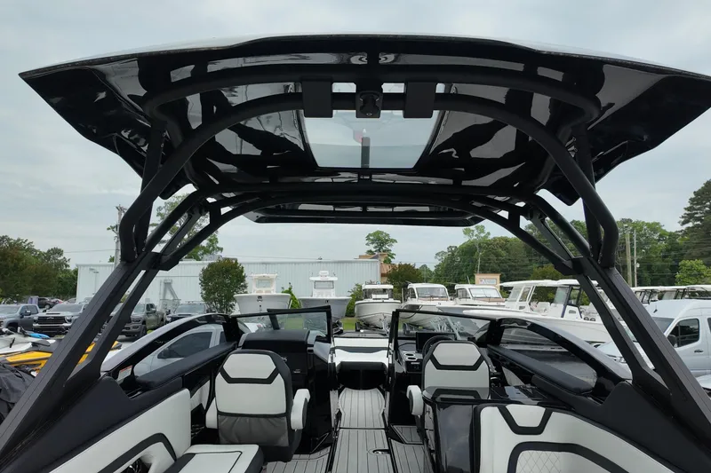 Slide: The Image of 2025 Yamaha 275 SD boat interior with sleek seating and modern design. - 8